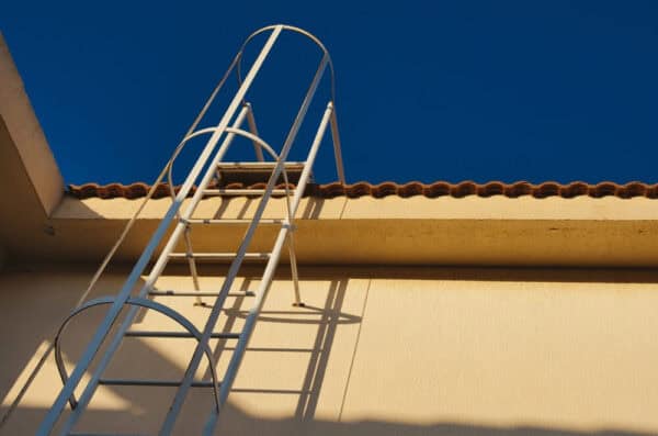 metal ladder permanently attached to the side of a commercial building