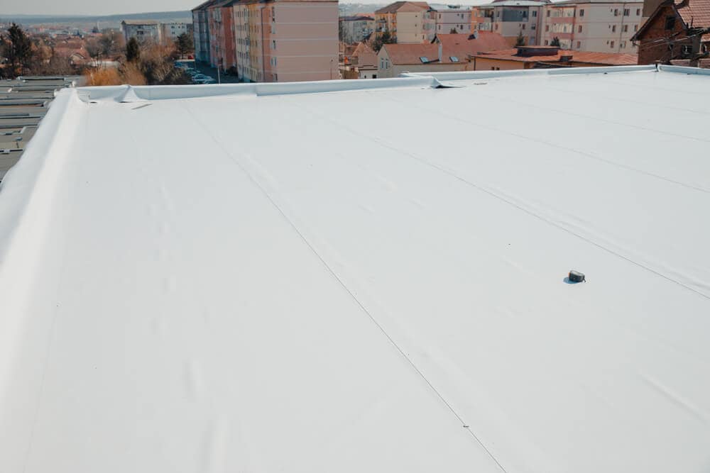 A Sika Sarnafil commercial roofing membrane being installed