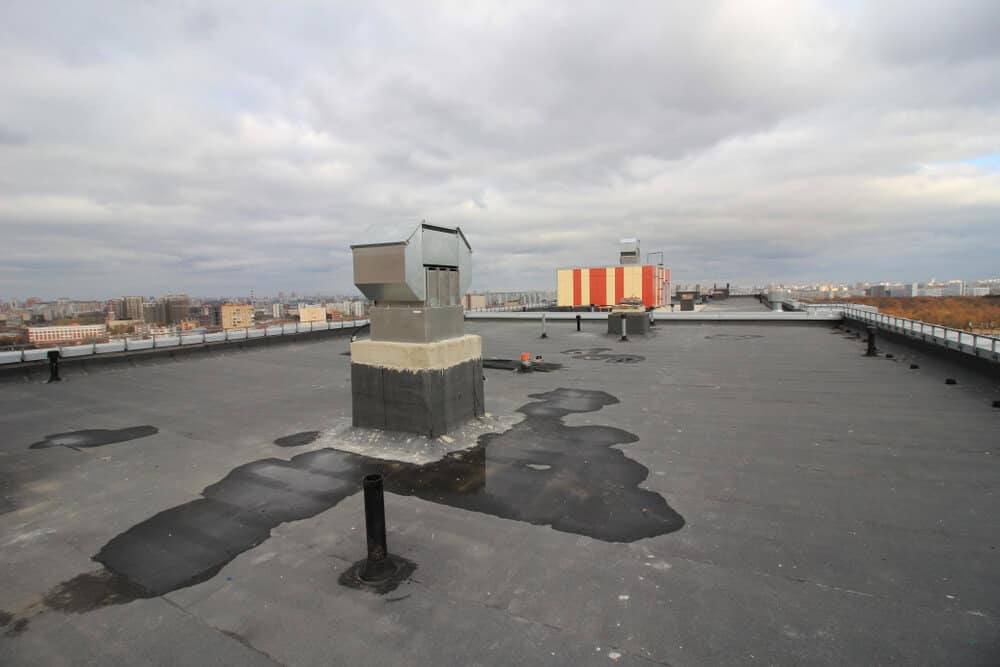Commercial roof leaks can start from anywhere, including flashing, seams, and drains.